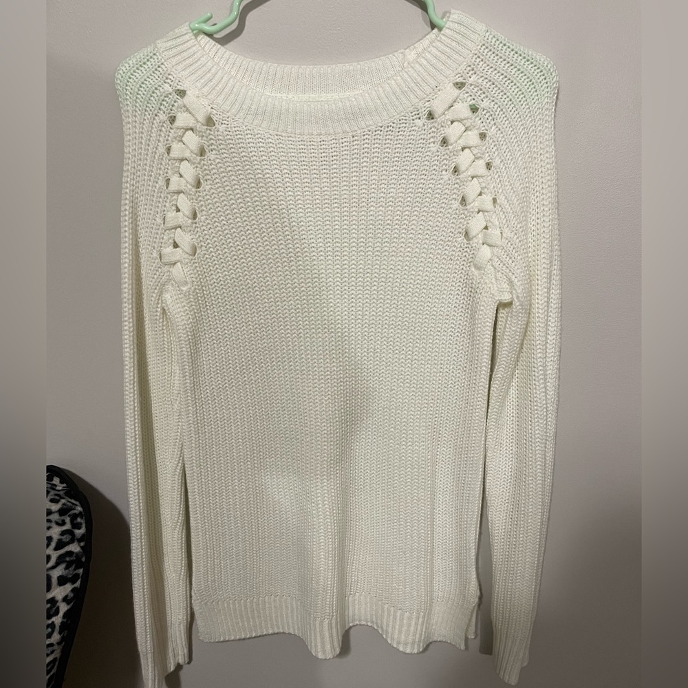 Brand new never worn white sweater. Braided style along shoulder.